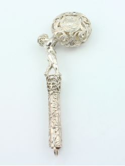Silver rattle "A boy with a ball"